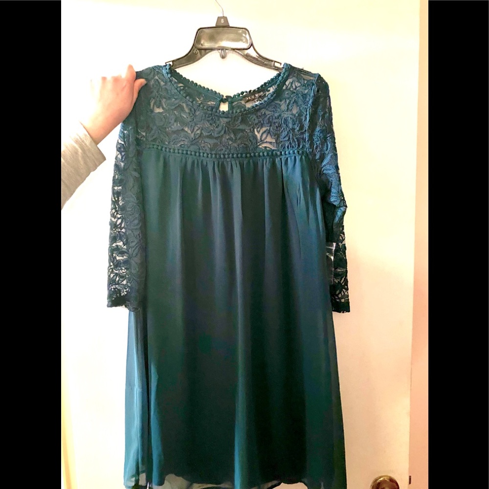 New with tags, green knee length dress with lace.